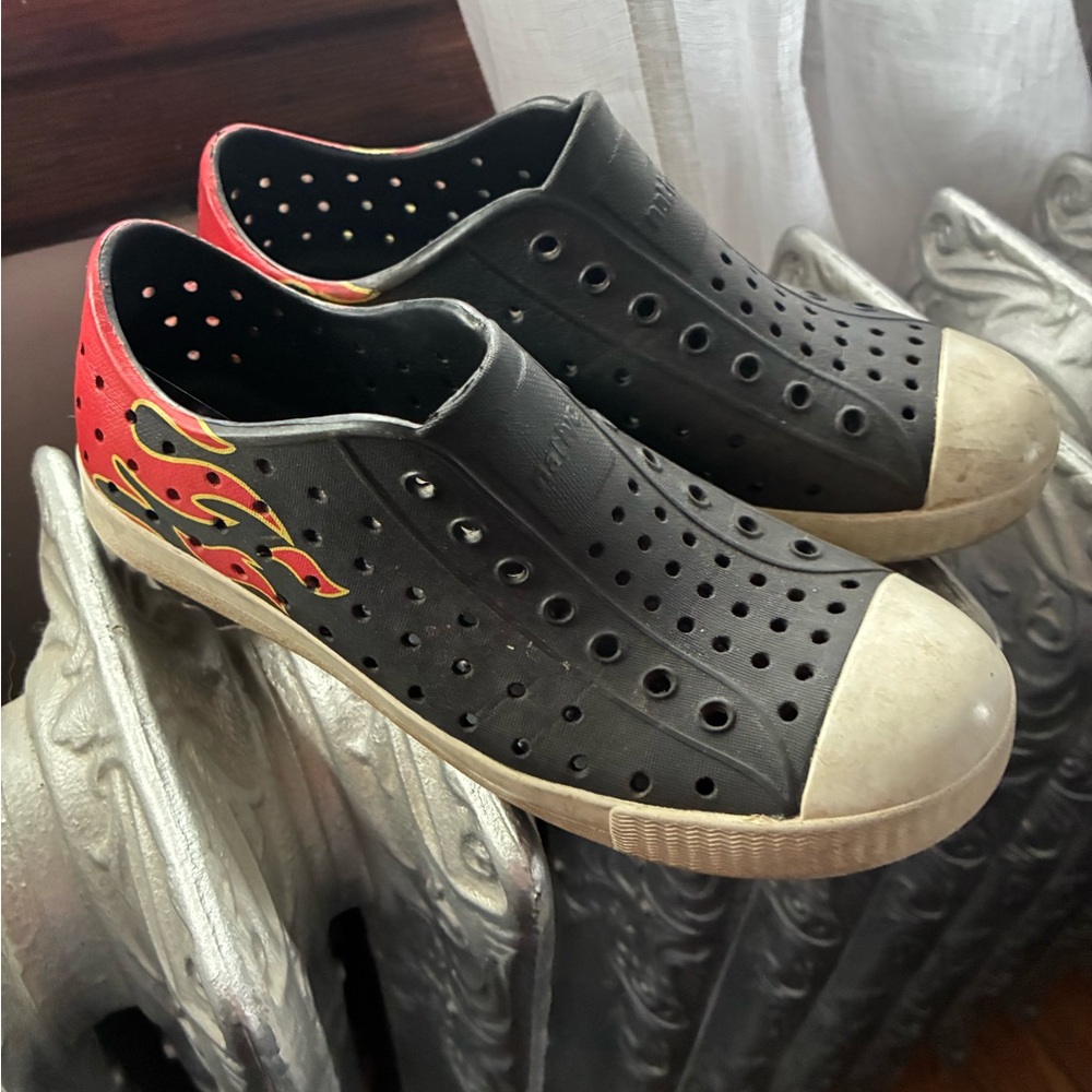 Native Shoes Black Slip-On Sneakers with Red and Yellow Flame Accent